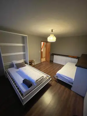 Ein Bett oder Betten in einem Zimmer der Unterkunft Wohnung in München