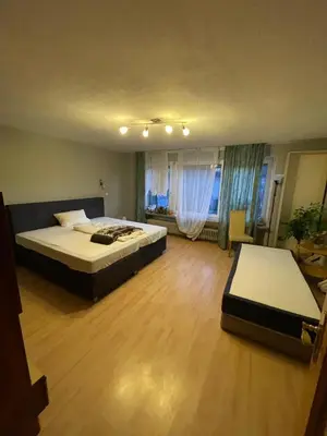 Ein Bett oder Betten in einem Zimmer der Unterkunft Wohnung in München