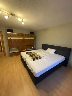Ein Bett oder Betten in einem Zimmer der Unterkunft Wohnung in München
