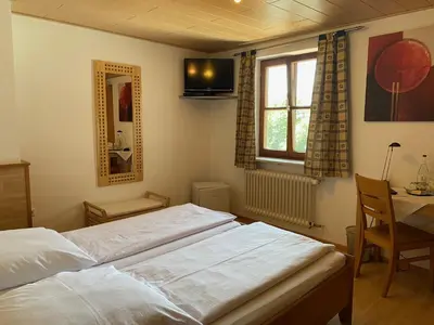 Ein Bett oder Betten in einem Zimmer der Unterkunft Waldgasthof Pension Baodwirt