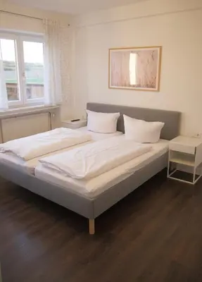 Ein Bett oder Betten in einem Zimmer der Unterkunft Hotel & Gasthof Wagner