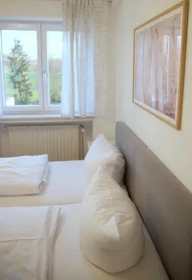 Ein Bett oder Betten in einem Zimmer der Unterkunft Hotel & Gasthof Wagner