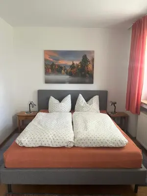 Ein Bett oder Betten in einem Zimmer der Unterkunft Ferienwohnung Suttner