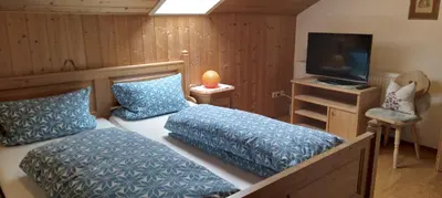Ein Bett oder Betten in einem Zimmer der Unterkunft Ferienwohnung am Marienbrunnen