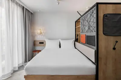 Ein Bett oder Betten in einem Zimmer der Unterkunft Stay KooooK Munich City