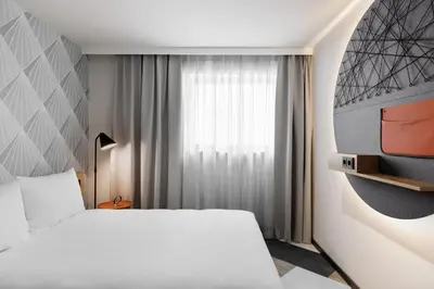 Ein Bett oder Betten in einem Zimmer der Unterkunft Stay KooooK Munich City