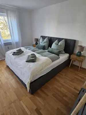 Ein Bett oder Betten in einem Zimmer der Unterkunft City-Appartement am Mühlbach-Kurpark