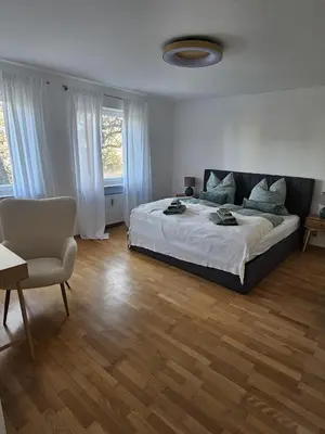 Ein Bett oder Betten in einem Zimmer der Unterkunft City-Appartement am Mühlbach-Kurpark