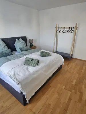 Ein Bett oder Betten in einem Zimmer der Unterkunft City-Appartement am Mühlbach-Kurpark