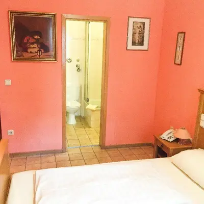 Ein Bett oder Betten in einem Zimmer der Unterkunft Pension Mona Lisa