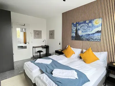 Ein Bett oder Betten in einem Zimmer der Unterkunft LTA Apartment München Süd No2 Relax & Chill