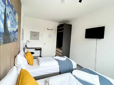 Ein Bett oder Betten in einem Zimmer der Unterkunft LTA Apartment München Süd No2 Relax & Chill
