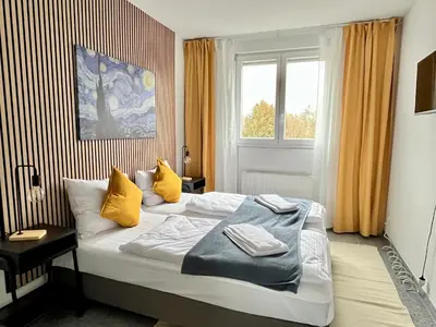 Ein Bett oder Betten in einem Zimmer der Unterkunft LTA Apartment München Süd No2 Relax & Chill