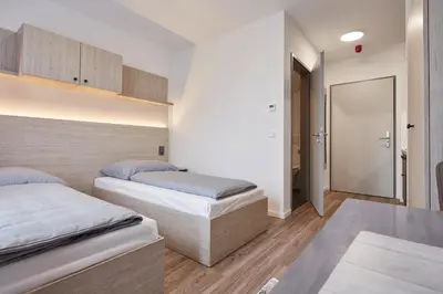 Ein Bett oder Betten in einem Zimmer der Unterkunft Bader Aparthotel