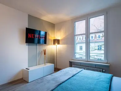 Ein Bett oder Betten in einem Zimmer der Unterkunft Wohnen in der Altstadt Augsburg