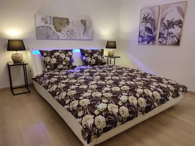 Ein Bett oder Betten in einem Zimmer der Unterkunft Ferienhaus Harmony