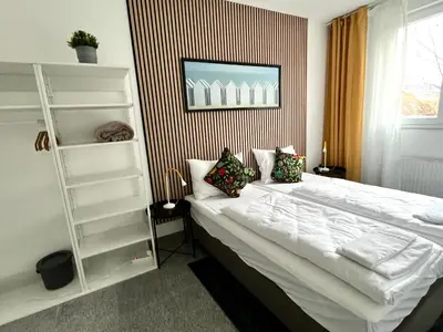 Ein Bett oder Betten in einem Zimmer der Unterkunft LTA Apartment München Süd No1 Fun & Games