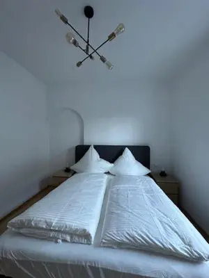 Ein Bett oder Betten in einem Zimmer der Unterkunft Haus Alpina