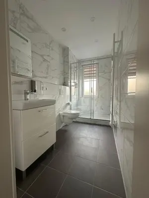 Ein Badezimmer in der Unterkunft Haus Alpina