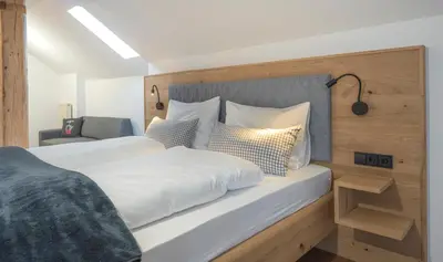 Ein Bett oder Betten in einem Zimmer der Unterkunft Pension BergMoment Ferienwohnungen oder Zimmer mit Frühstück