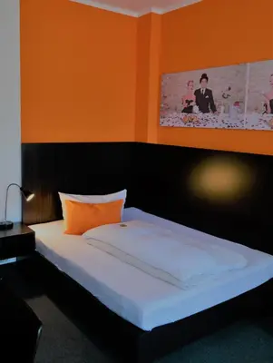 Ein Bett oder Betten in einem Zimmer der Unterkunft GS Hotel Mindelheim