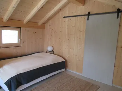 Ein Bett oder Betten in einem Zimmer der Unterkunft Ferienhaus Remise