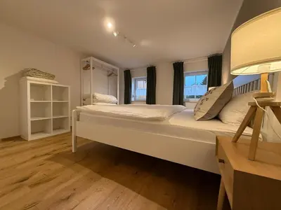 Ein Bett oder Betten in einem Zimmer der Unterkunft Ferienwohnung 