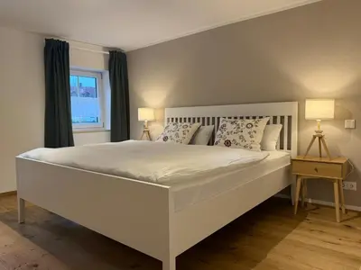 Ein Bett oder Betten in einem Zimmer der Unterkunft Ferienwohnung 