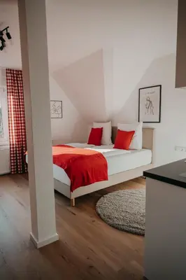 Ein Bett oder Betten in einem Zimmer der Unterkunft Eichel Apartments