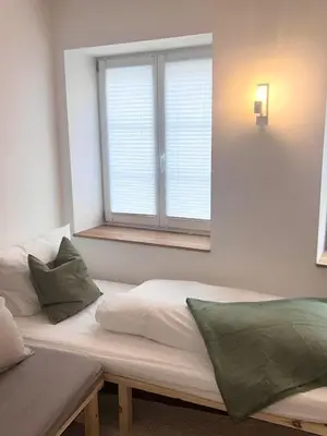 Ein Bett oder Betten in einem Zimmer der Unterkunft Altstadtsuite Landsberg am Lech
