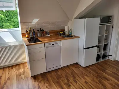Küche/Küchenzeile in der Unterkunft Dachgeschosswohnung 1 - Apartments am Schloss