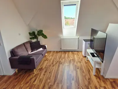 Ein Sitzbereich in der Unterkunft Dachgeschosswohnung 1 - Apartments am Schloss