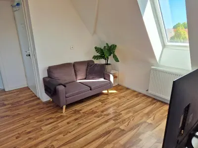 Ein Sitzbereich in der Unterkunft Dachgeschosswohnung 1 - Apartments am Schloss