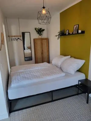 Ein Bett oder Betten in einem Zimmer der Unterkunft Suite 2 - Apartments am Schloss