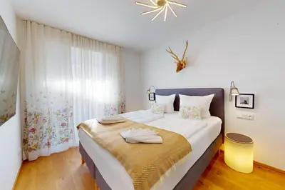 Ein Bett oder Betten in einem Zimmer der Unterkunft Stella Alpina