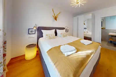 Ein Bett oder Betten in einem Zimmer der Unterkunft Stella Alpina