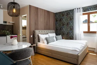 Ein Bett oder Betten in einem Zimmer der Unterkunft Marie - serviced Apartments an der Messe München