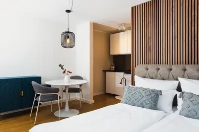 Ein Bett oder Betten in einem Zimmer der Unterkunft Marie - serviced Apartments an der Messe München
