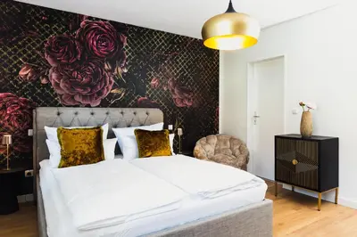 Ein Bett oder Betten in einem Zimmer der Unterkunft Marie - serviced Apartments an der Messe München