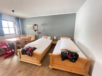 Ein Bett oder Betten in einem Zimmer der Unterkunft Ferienwohnung Berglodge Chiemsee