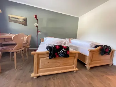 Ein Bett oder Betten in einem Zimmer der Unterkunft Ferienwohnung Berglodge Chiemsee