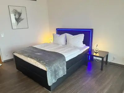 Ein Bett oder Betten in einem Zimmer der Unterkunft Tower Suite Hotelturm Augsburg