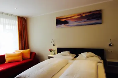 Ein Bett oder Betten in einem Zimmer der Unterkunft Hotel Gasthof zum Anker