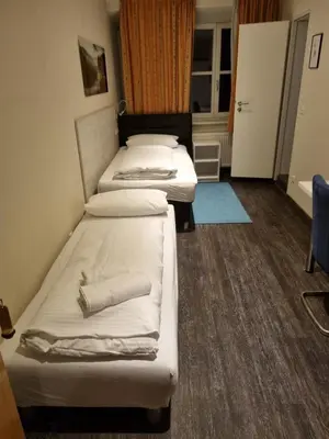 Ein Bett oder Betten in einem Zimmer der Unterkunft Hotel Gasthof zum Anker