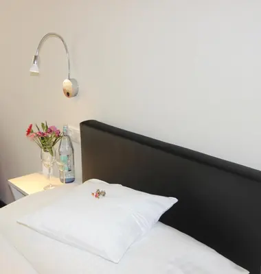 Ein Bett oder Betten in einem Zimmer der Unterkunft Hotel Gasthof zum Anker