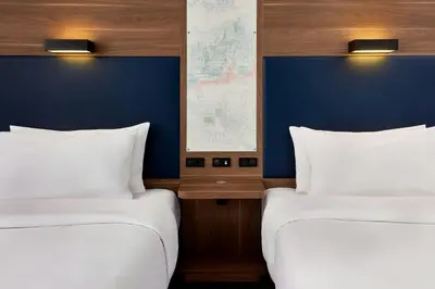 Ein Bett oder Betten in einem Zimmer der Unterkunft Aloft München