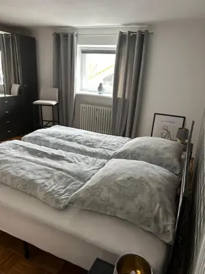 Ein Bett oder Betten in einem Zimmer der Unterkunft Schöne Ferienwohnung in Landsberg am Lech