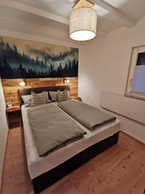 Ein Bett oder Betten in einem Zimmer der Unterkunft Kleines Haus im Grünen
