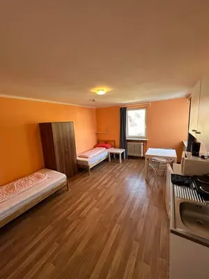 Ein Bett oder Betten in einem Zimmer der Unterkunft 2-Rent Group Hostel Apartments HAN53