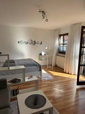 Ein Sitzbereich in der Unterkunft Cozy City Apartment Penzberg
